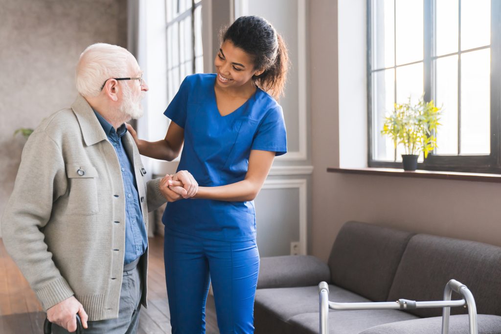 Young Caring Nurse with Hospice Client